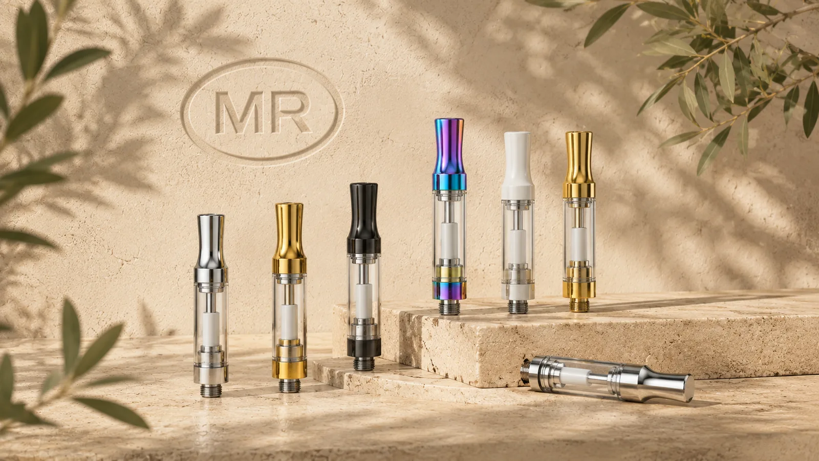 Close-up of glass vape cartridges with ceramic cores and metal finishes