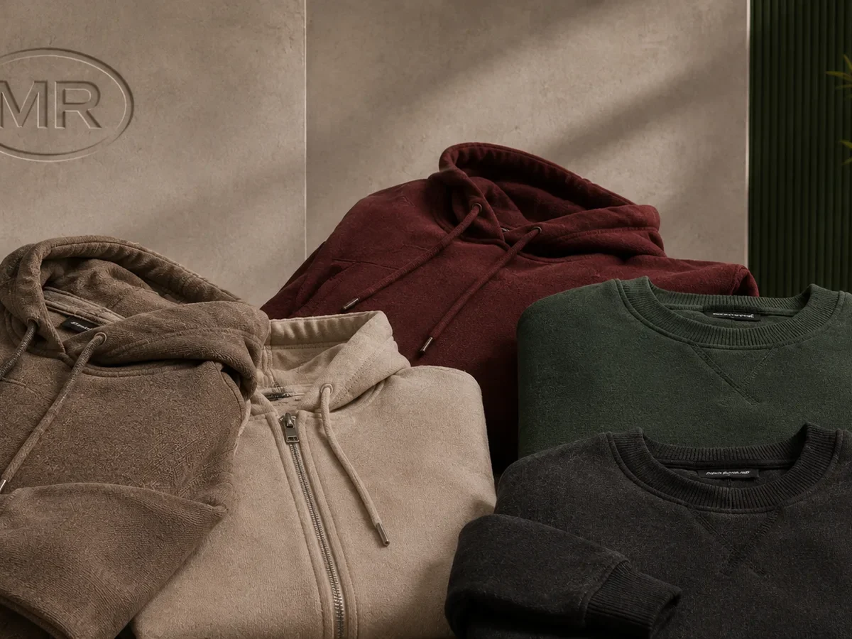 Close-up of white label hoodie and sweatshirt fabric and branding detail